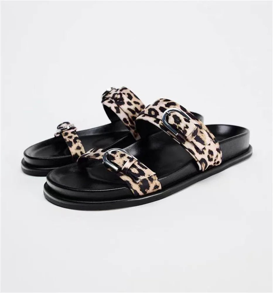Stylish Women's designer Chic Flat Sandals featuring animal print and slip-on design, perfect for casual summer outings.