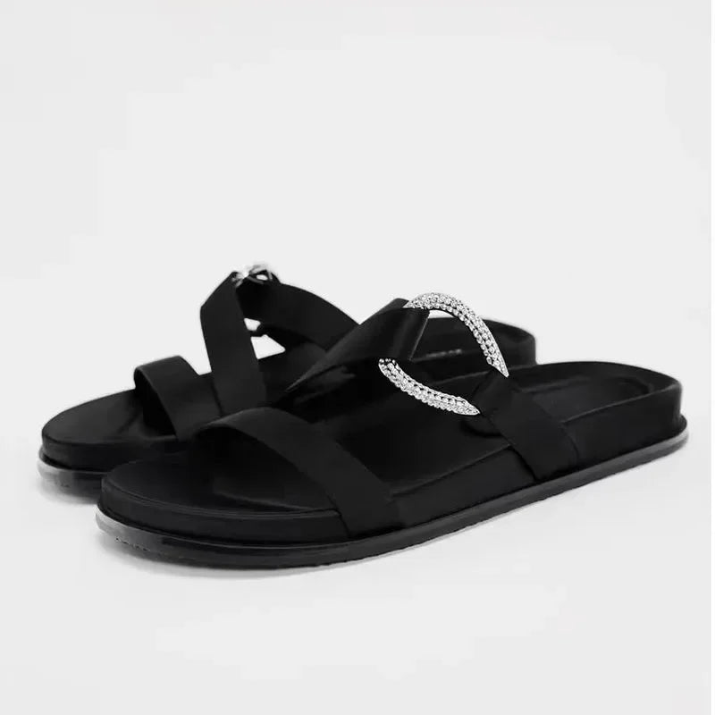 Stylish Women's designer Chic Flat Sandals featuring animal print and slip-on design, perfect for casual summer outings.