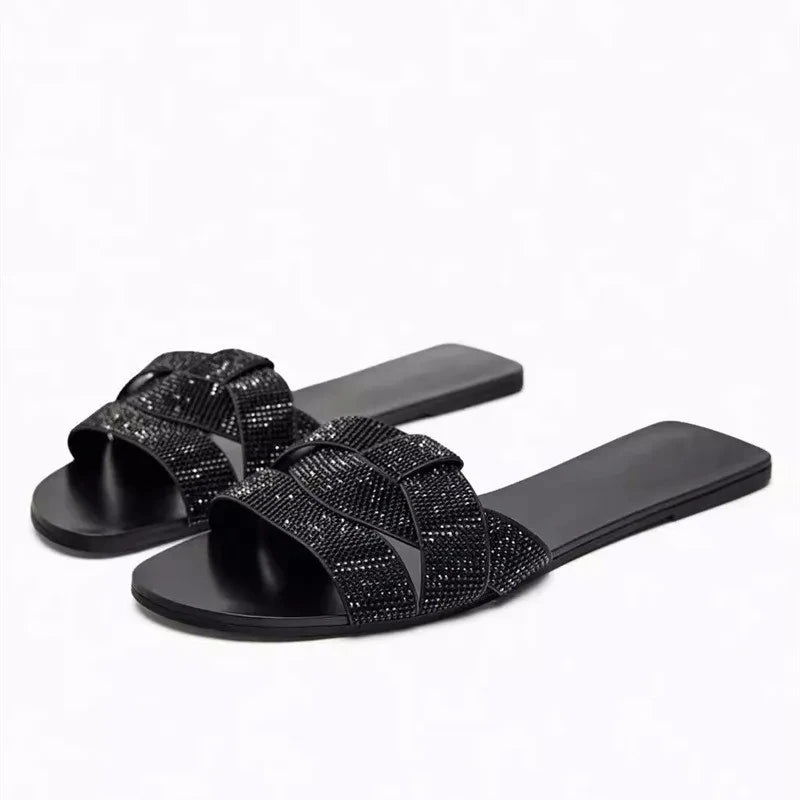Stylish Women's designer Chic Flat Sandals featuring animal print and slip-on design, perfect for casual summer outings.