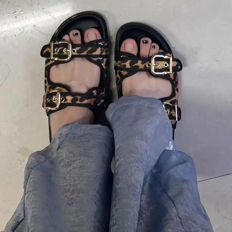 Stylish Women's designer Chic Flat Sandals featuring animal print and slip-on design, perfect for casual summer outings.