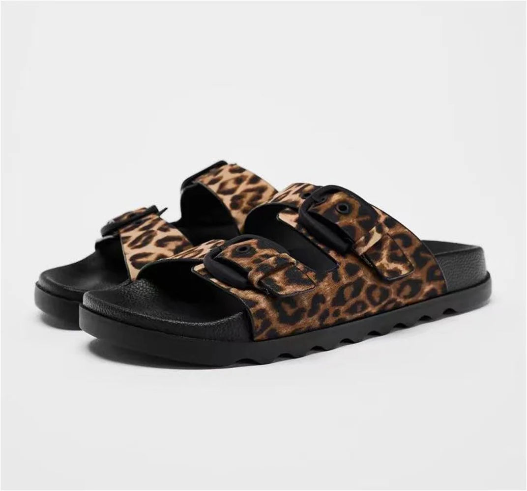 Stylish Women's designer Chic Flat Sandals featuring animal print and slip-on design, perfect for casual summer outings.