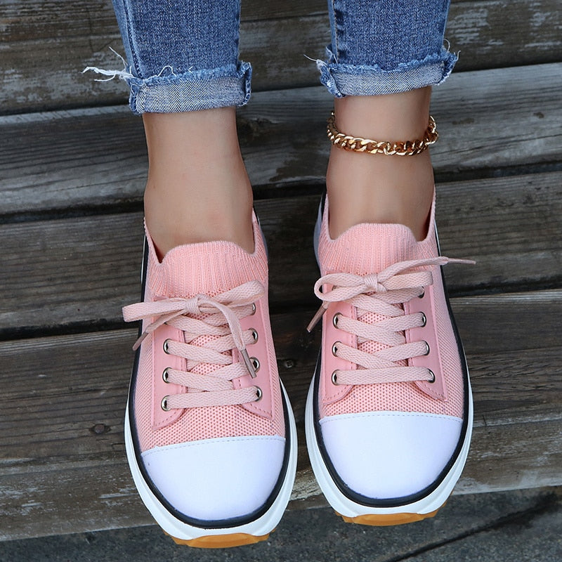 A pair of women's summer knitted breathable sneakers with a stylish design, featuring a lightweight knitted upper and durable vulcanized sole.