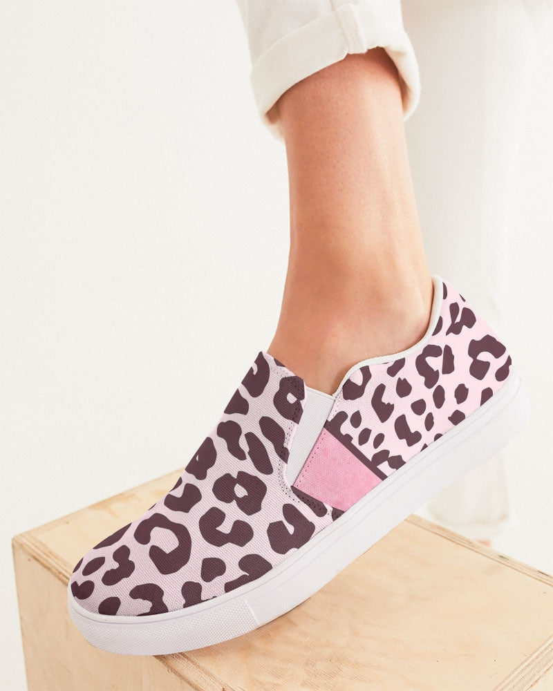 Women's slip-on canvas shoe featuring a vibrant pink leopard print design, perfect for stylish comfort.