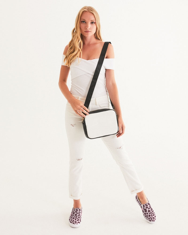 Women's slip-on canvas shoe featuring a vibrant pink leopard print design, perfect for stylish comfort.