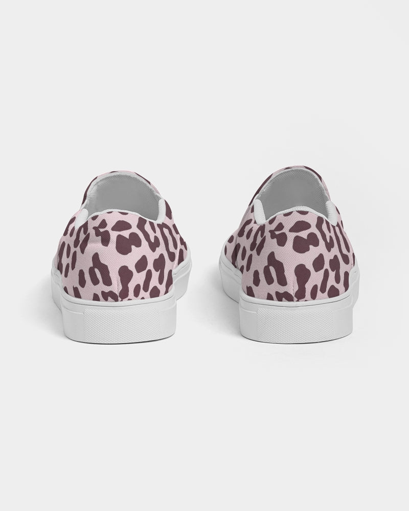 Women's slip-on canvas shoe featuring a vibrant pink leopard print design, perfect for stylish comfort.