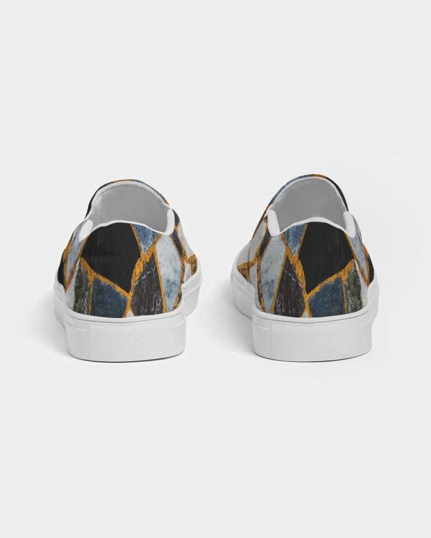 Womens Canvas Slip On Sneakers in Black Mosaic Print, showcasing a stylish design with elastic side accents and a padded collar.