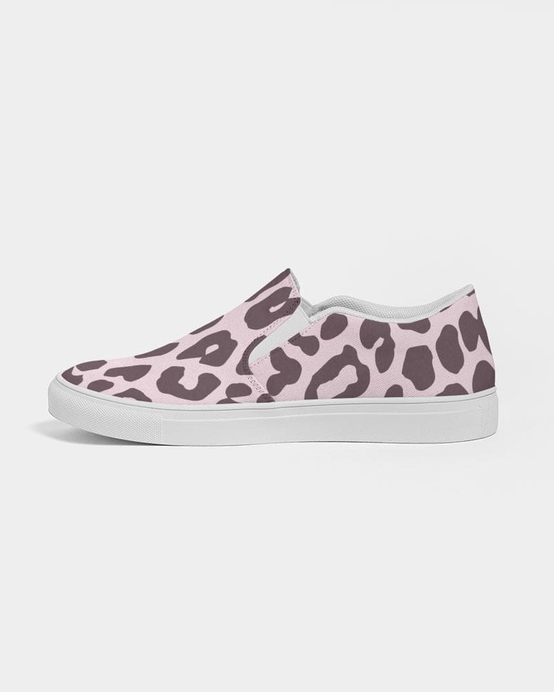 A pair of women's canvas slip-on sneakers featuring a vibrant pink leopard print design, perfect for casual wear.