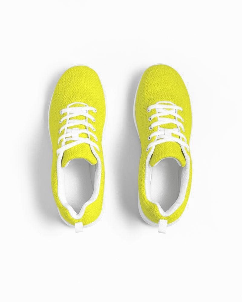 A pair of vibrant yellow canvas women's sneakers with a lace-up front, padded collar, and breathable lining, perfect for sports and running.