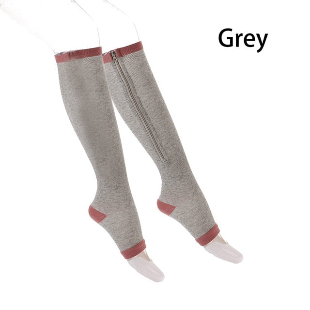 A pair of unisex compression socks with a zipper, designed for leg support and comfort, suitable for both men and women.