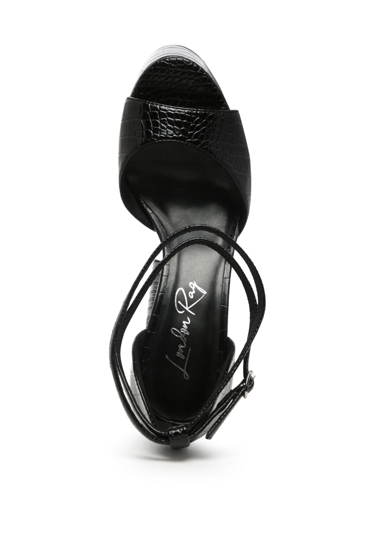 Alice Croc Platform Heeled Sandals featuring a chic croc texture, high block heel, and ankle pin-buckle fastening in solid black.