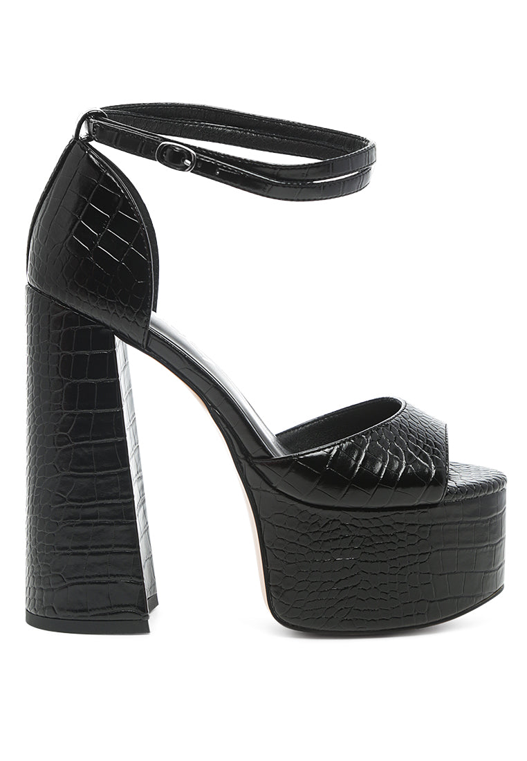 Alice Croc Platform Heeled Sandals featuring a chic croc texture, high block heel, and ankle pin-buckle fastening in solid black.