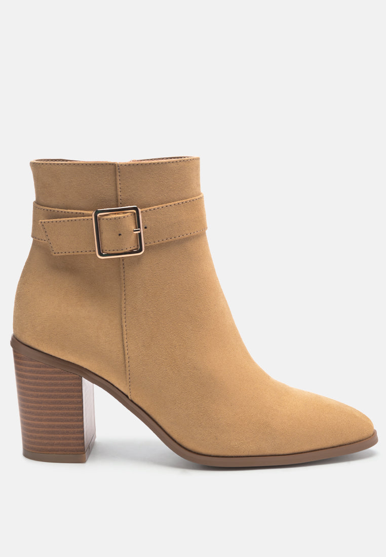 Stylish taupe faux suede ankle boots with pointed toe and buckle detail, featuring a side zipper and block heel.