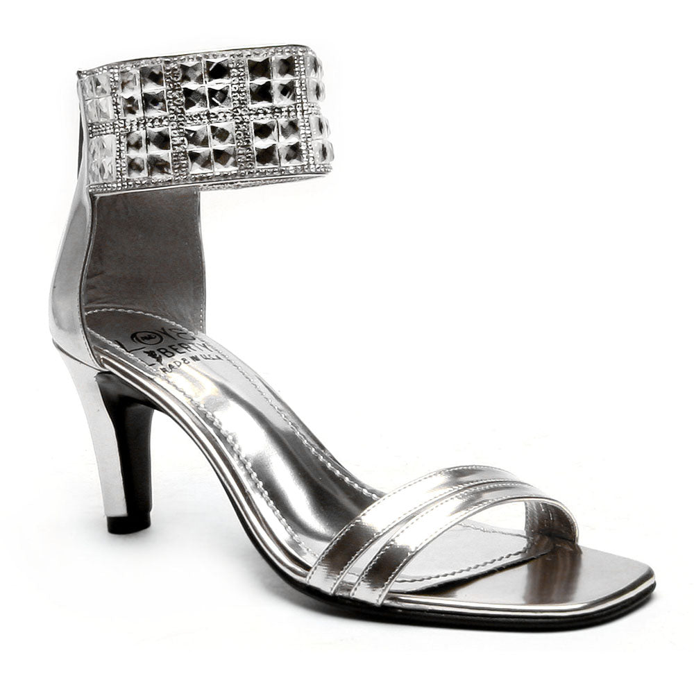 Attraction mid-height classy heel featuring a stiletto design, ankle cuff with gemstone accent, and double banded toe straps.