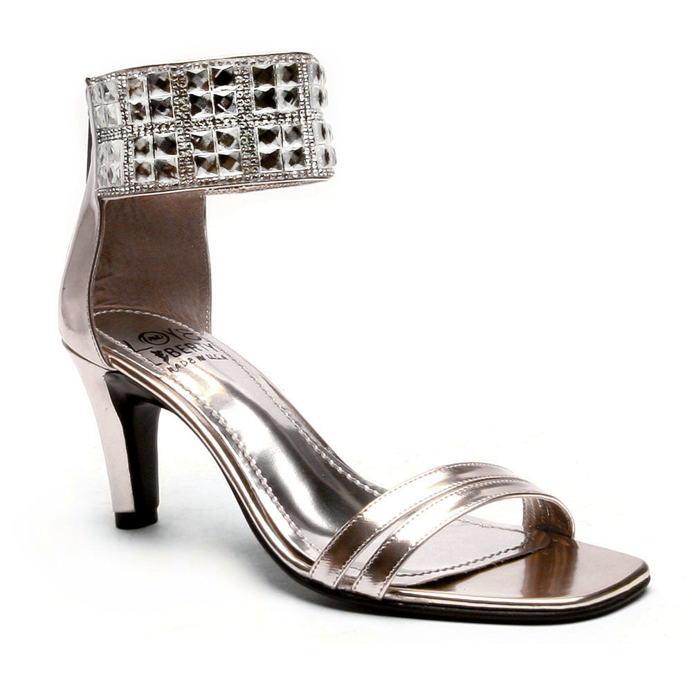 Attraction mid-height classy heel featuring a stiletto design, ankle cuff with gemstone accent, and double banded toe straps.