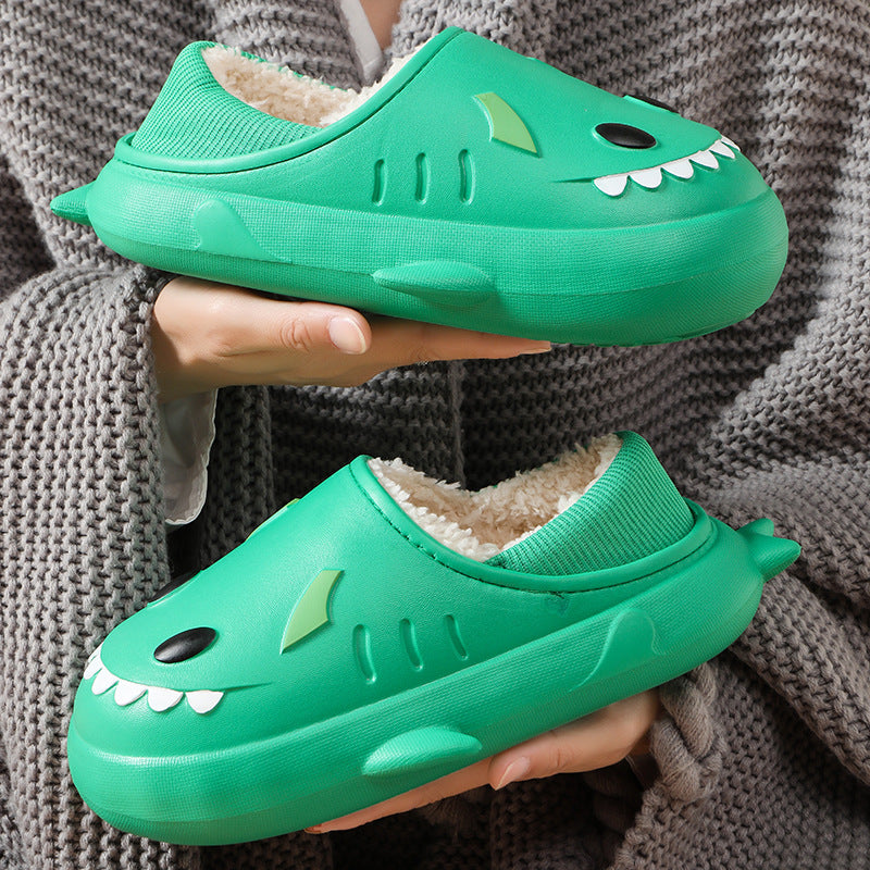 Cute women's waterproof shark cotton slippers in a cozy indoor setting, showcasing their playful design and soft material.