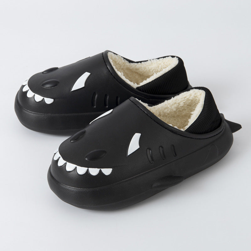 Cute women's waterproof shark cotton slippers in a cozy indoor setting, showcasing their playful design and soft material.