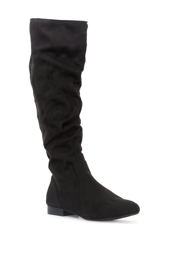 Becca Microfiber Knee High Boot showcasing stylish design with side zipper and low heel, perfect for winter wear.