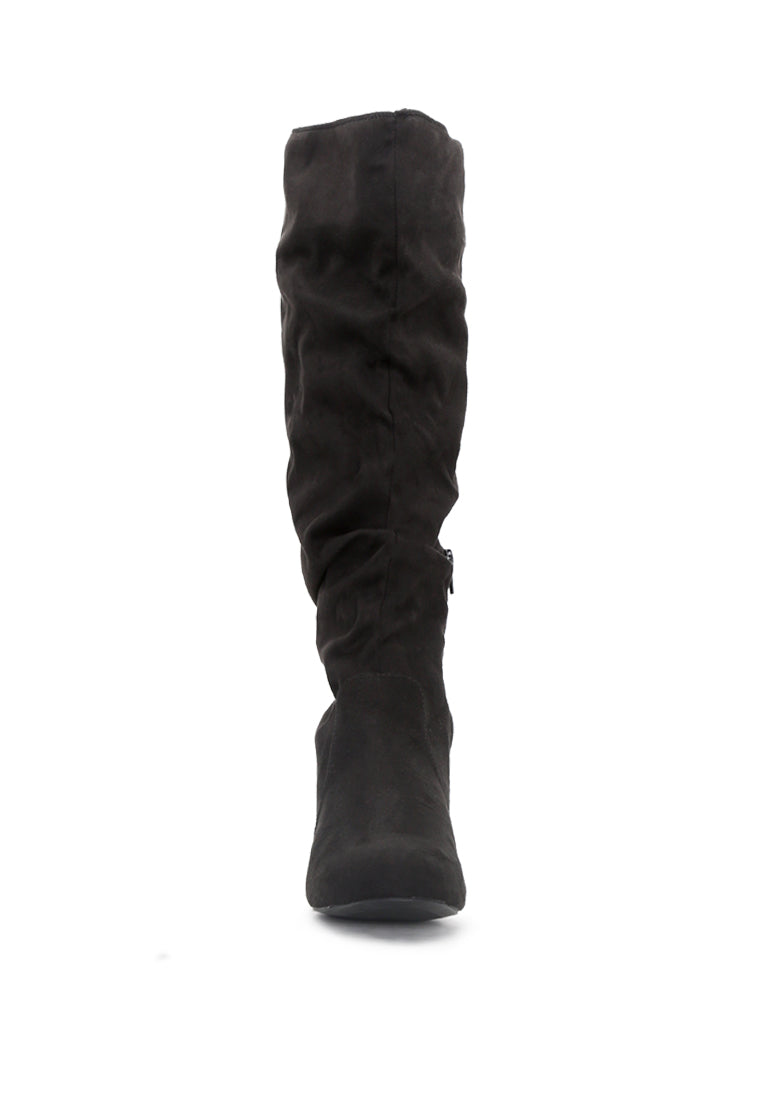 Becca Microfiber Knee High Boot showcasing stylish design with side zipper and low heel, perfect for winter wear.