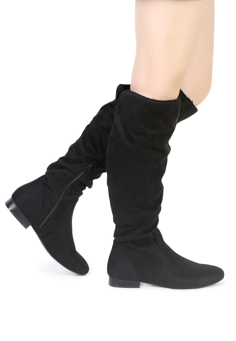 Becca Microfiber Knee High Boot showcasing stylish design with side zipper and low heel, perfect for winter wear.