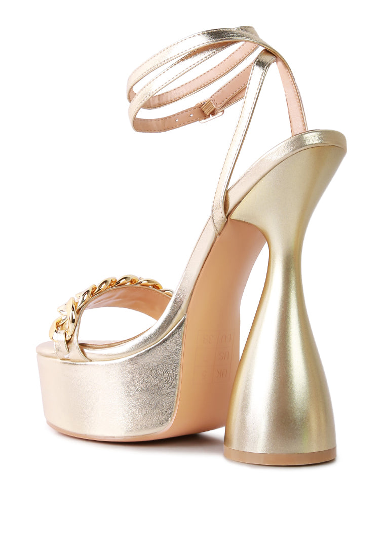 Big Bash Metallic High Platform Chunky Sandals featuring gold metallic faux leather, hourglass heel, and gold chain embellishment.