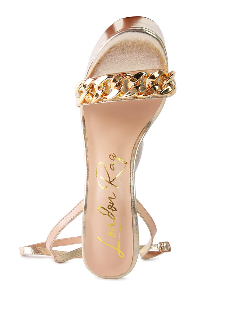Big Bash Metallic High Platform Chunky Sandals featuring gold metallic faux leather, hourglass heel, and gold chain embellishment.
