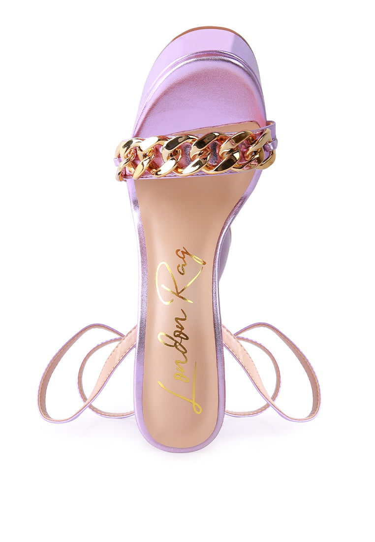 Big Bash Metallic High Platform Chunky Sandals featuring gold metallic faux leather, hourglass heel, and gold chain embellishment.