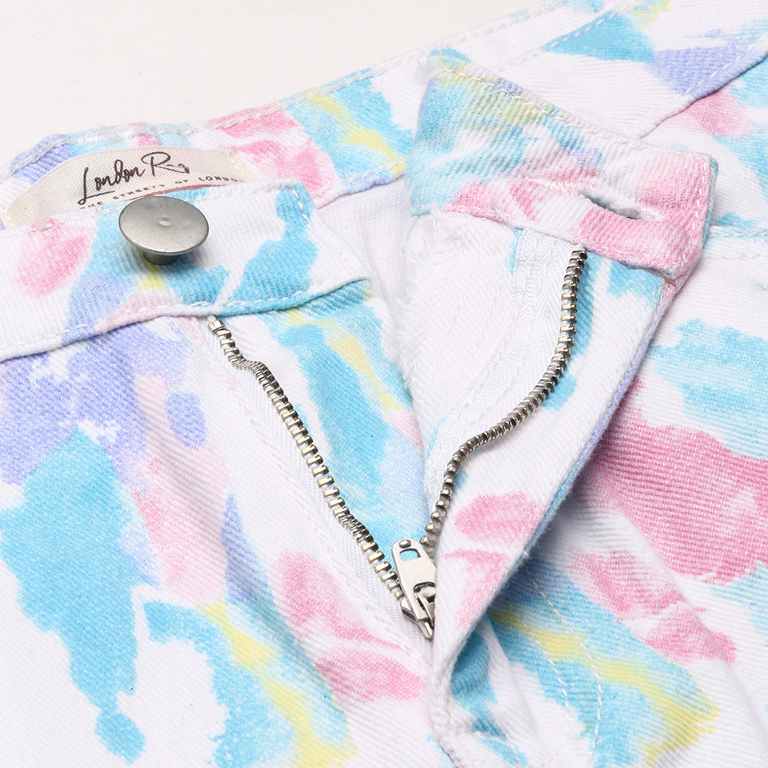 Blue dip dye raw hem shorts with pockets and belt loops, perfect for summer wear.