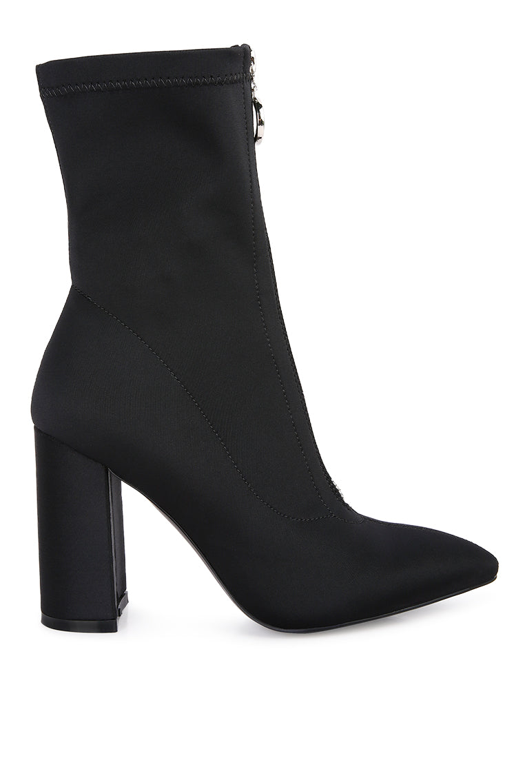 Bobbettes Block Heeled Microfiber Ankle Boot featuring a metallic zipper and a stylish block heel, designed for comfort and elegance.