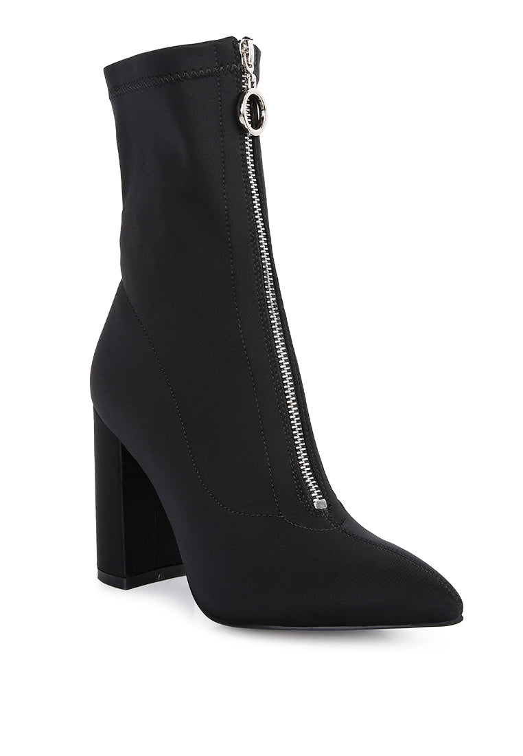Bobbettes Block Heeled Microfiber Ankle Boot featuring a metallic zipper and a stylish block heel, designed for comfort and elegance.