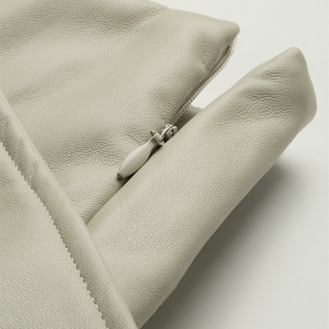 A stylish Bodycon Mini Slit Skirt featuring buckle details, showcasing its sleek design and soft fabric.