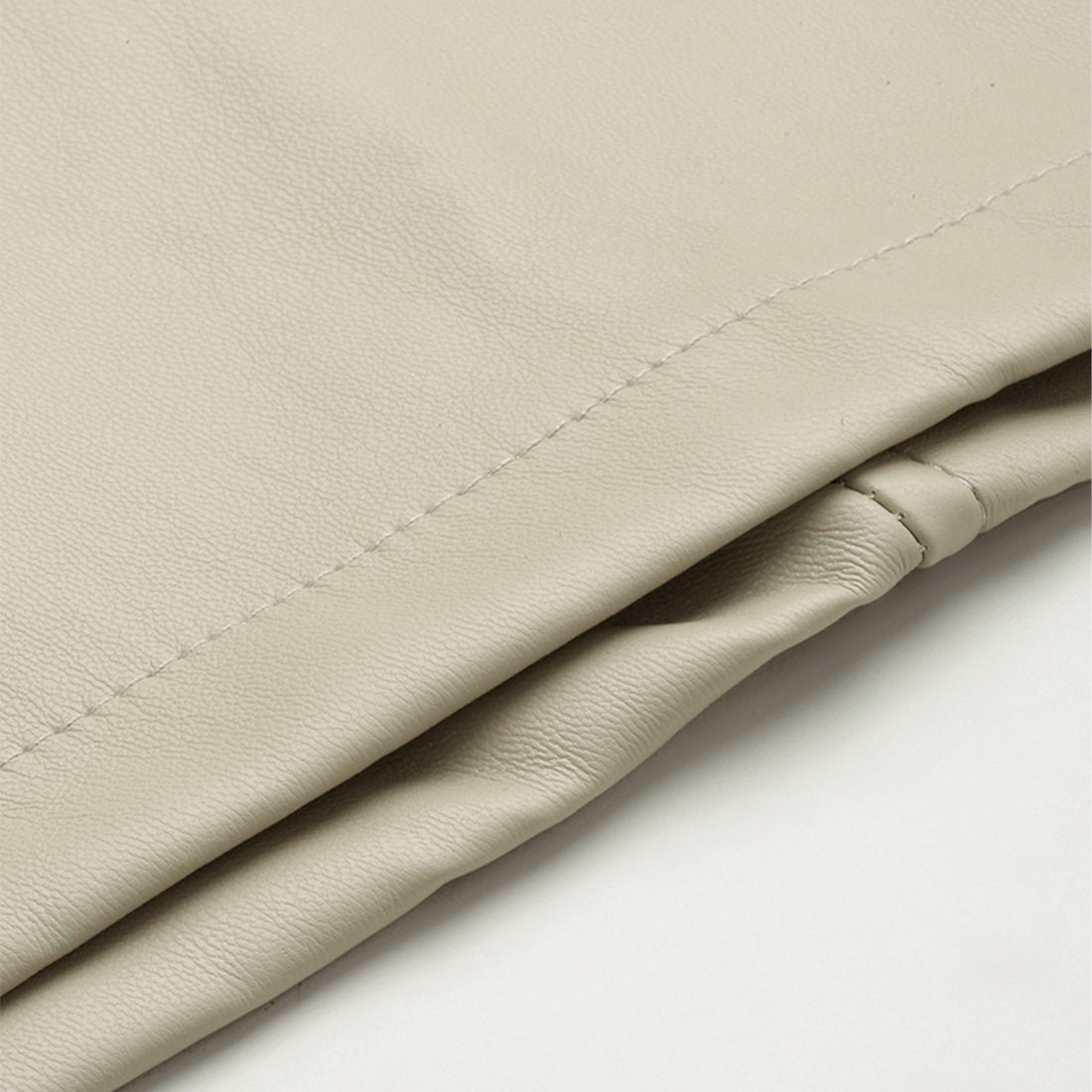 A stylish Bodycon Mini Slit Skirt featuring buckle details, showcasing its sleek design and soft fabric.