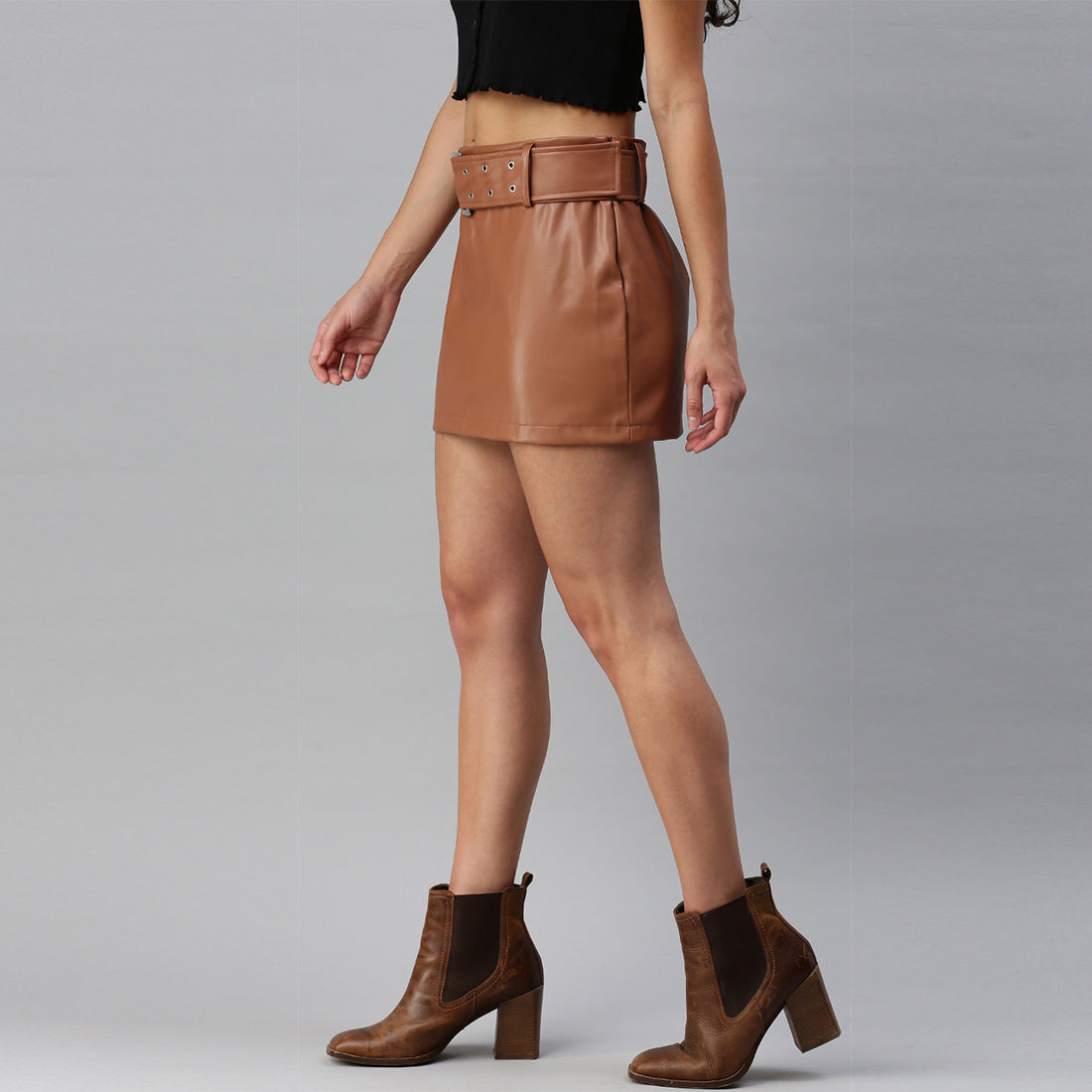 A stylish Bodycon Mini Slit Skirt featuring buckle details, showcasing its sleek design and soft fabric.