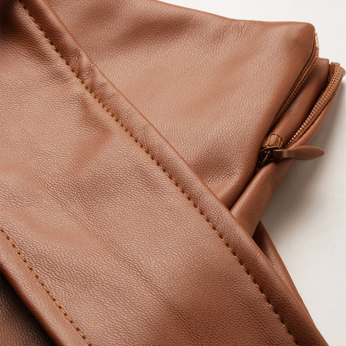 A stylish Bodycon Mini Slit Skirt featuring buckle details, showcasing its sleek design and soft fabric.