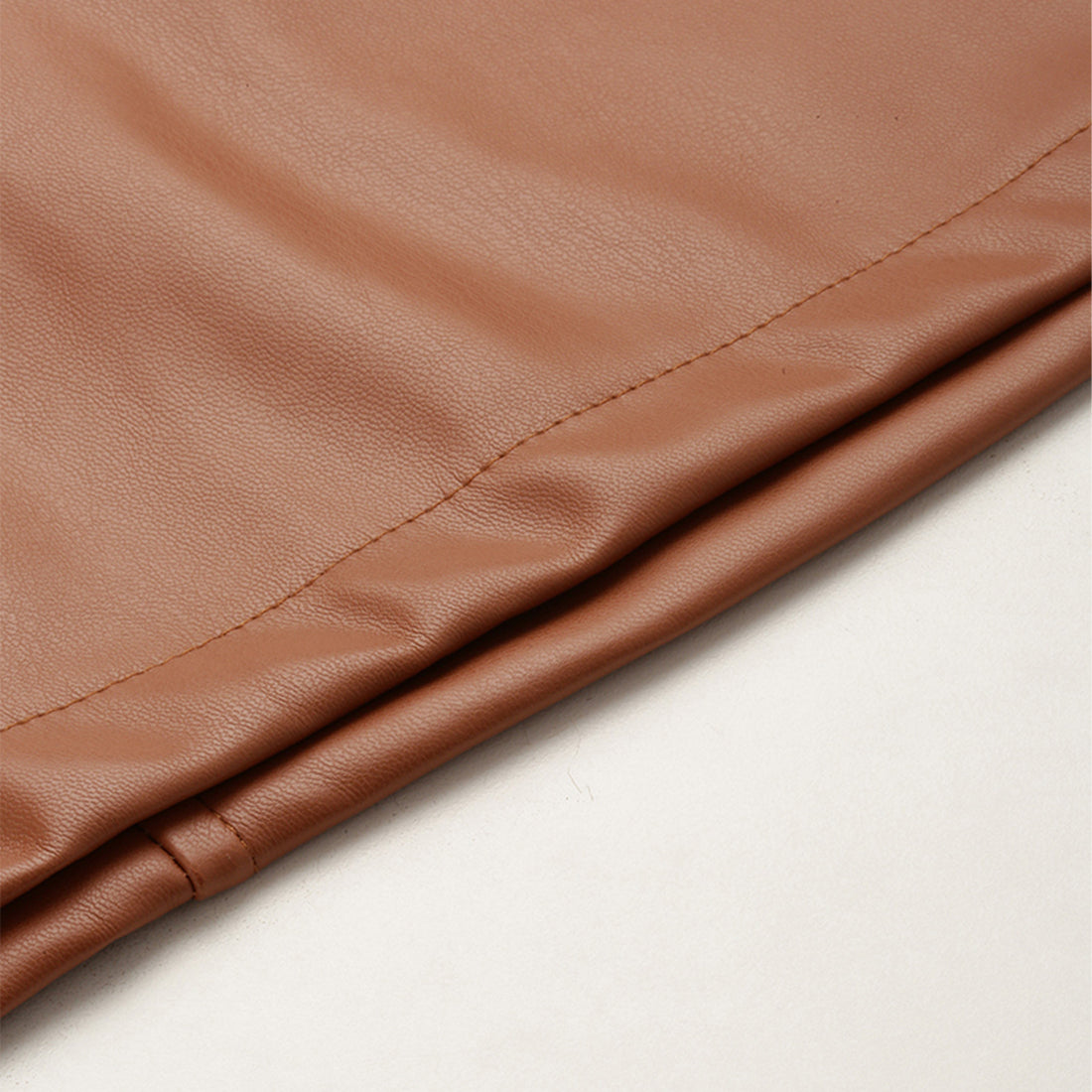 A stylish Bodycon Mini Slit Skirt featuring buckle details, showcasing its sleek design and soft fabric.