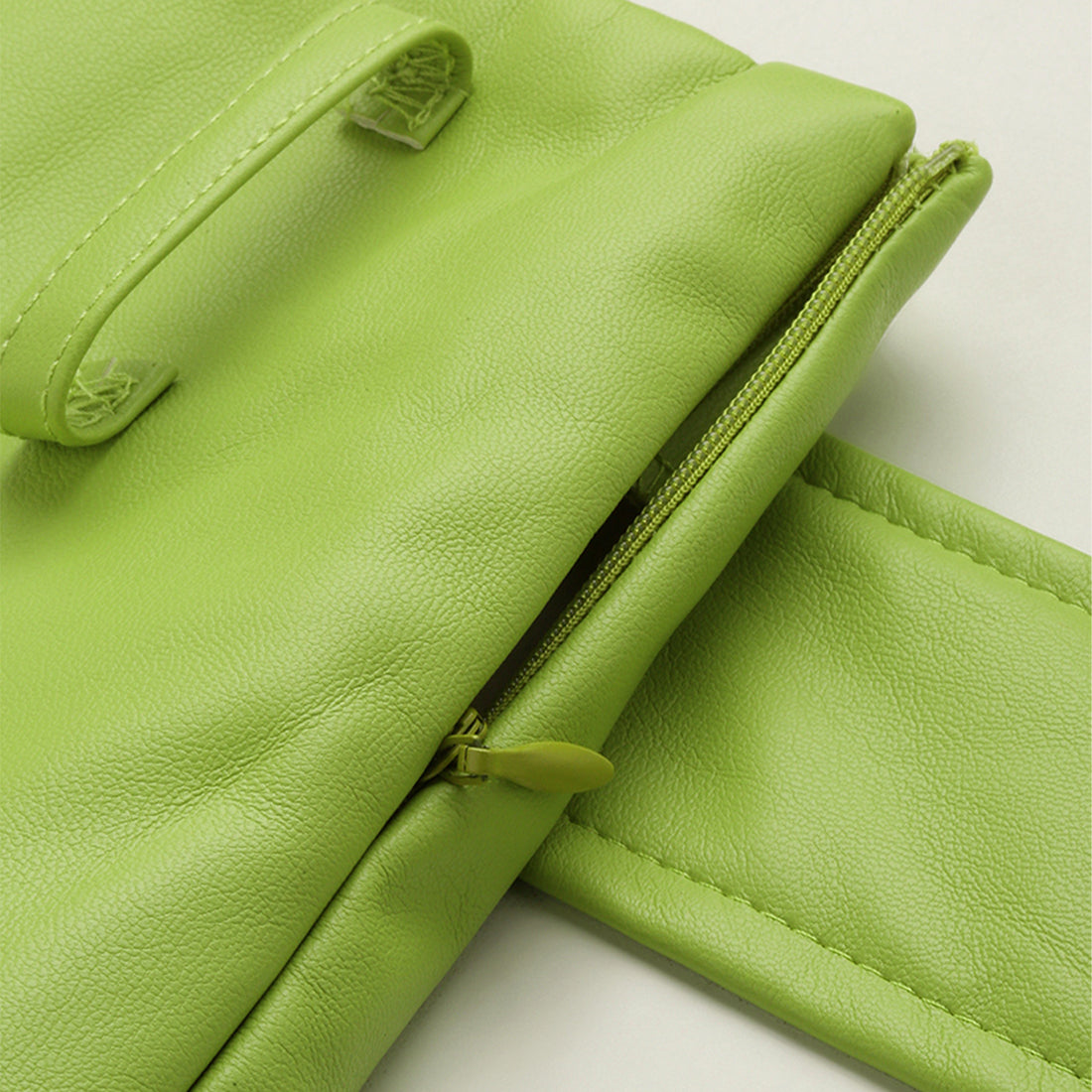 A stylish Bodycon Mini Slit Skirt featuring buckle details, showcasing its sleek design and soft fabric.