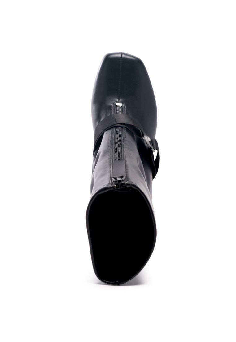 Stylish Boomer Chunky High Block Heel Boots with buckle strap and front zipper, made from faux leather.