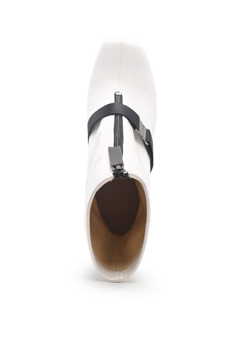 Stylish Boomer Chunky High Block Heel Boots with buckle strap and front zipper, made from faux leather.