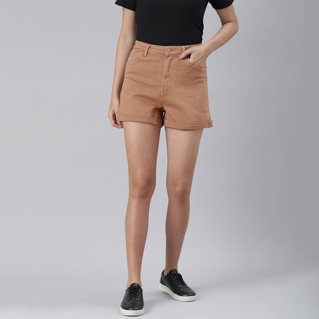 Camel high waist shorts with upturned hem and pockets, showcasing a stylish summer look.