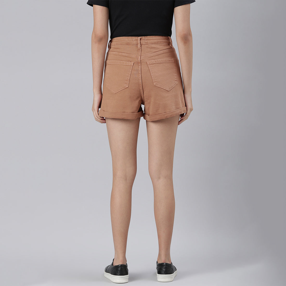 Camel high waist shorts with upturned hem and pockets, showcasing a stylish summer look.