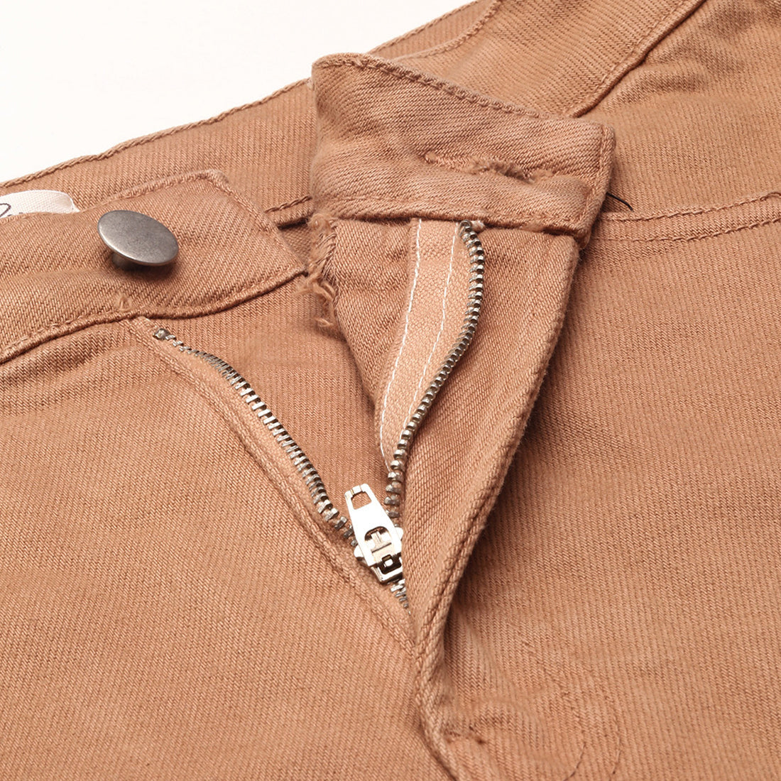 Camel high waist shorts with upturned hem and pockets, showcasing a stylish summer look.