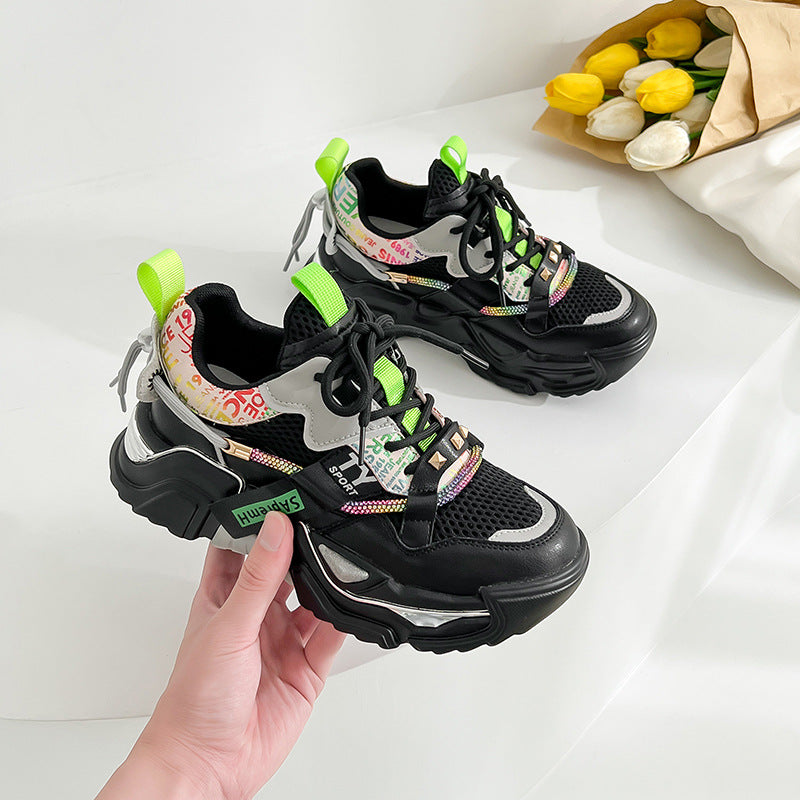 A pair of stylish women's casual sports shoes in white, made from genuine leather with a molded insole and lightweight polyurethane sole.