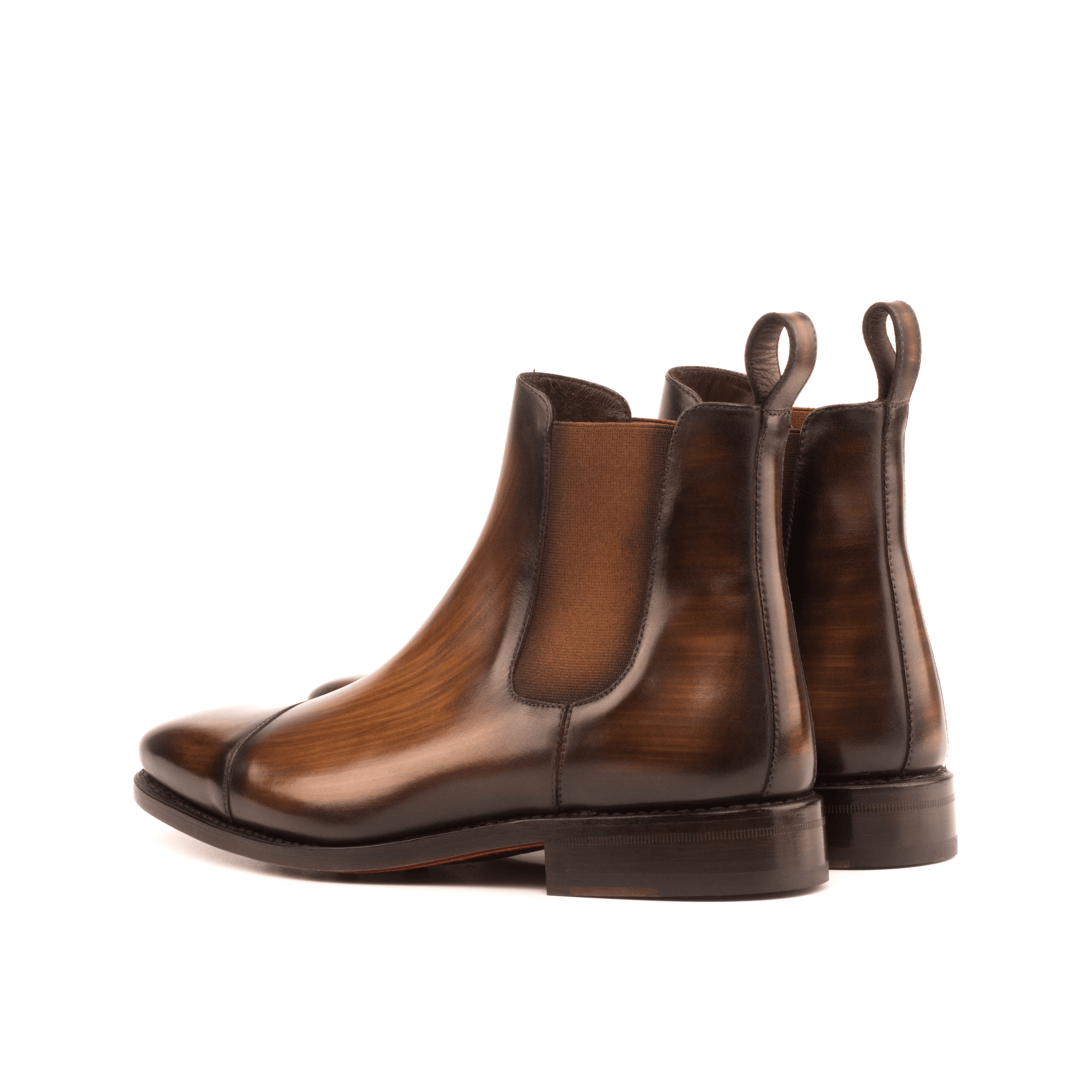 Chayton Patina Chelsea Boots II showcasing brown crust patina leather, elegant design, and dark red Goodyear leather sole.