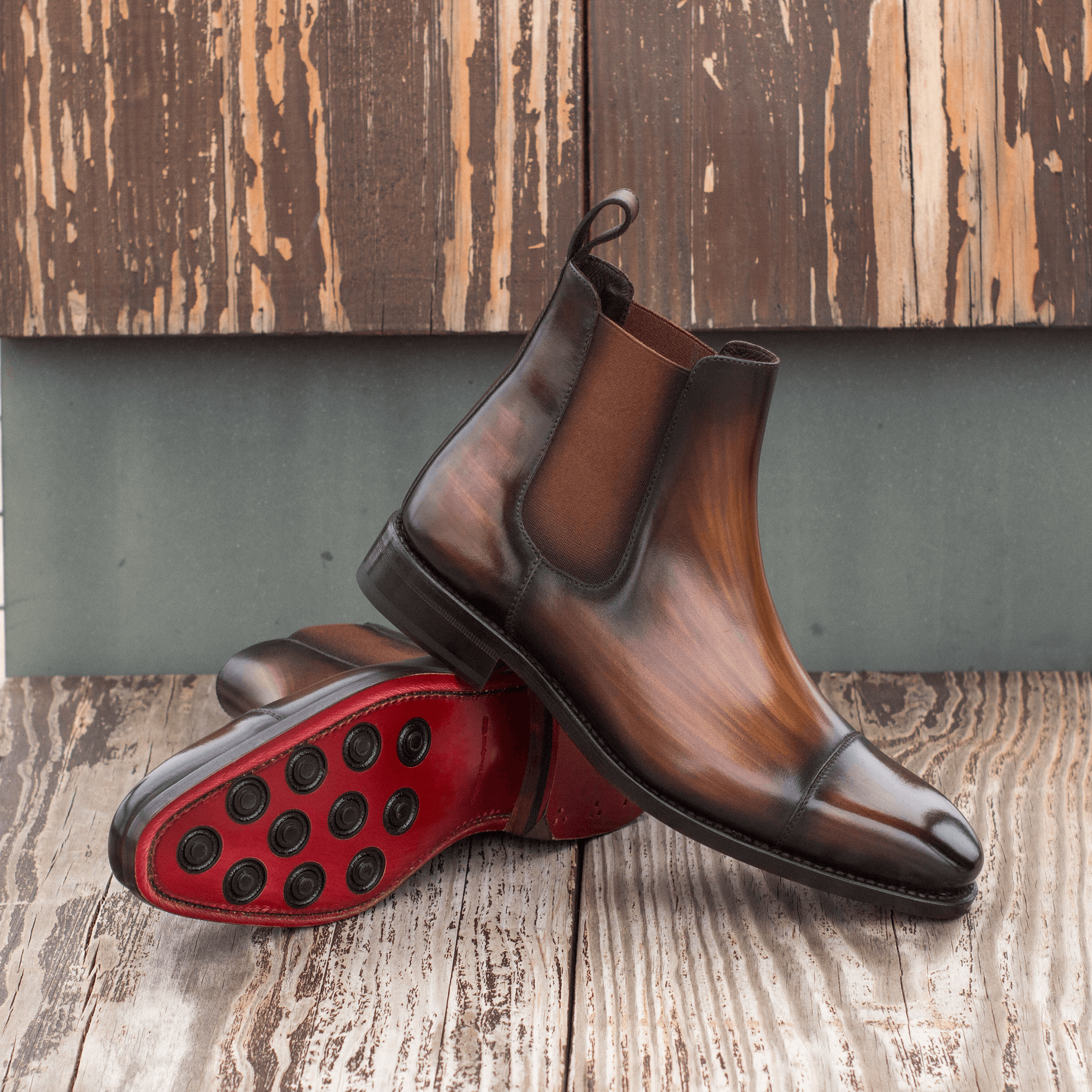 Chayton Patina Chelsea Boots II showcasing brown crust patina leather, elegant design, and dark red Goodyear leather sole.