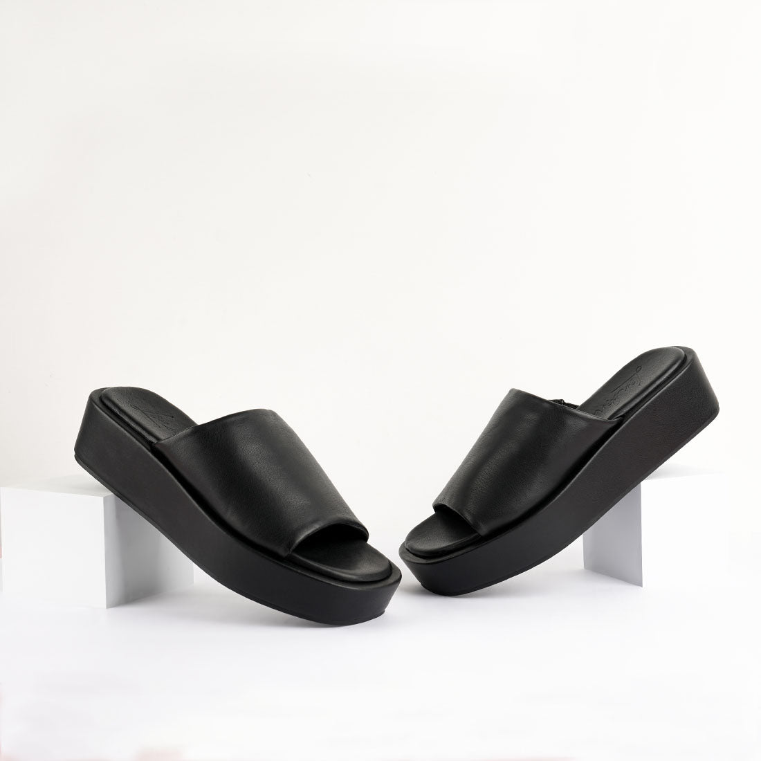 Chomper Black Platform Sliders featuring a thick strap vamp and soft cushion insoles, perfect for casual wear.