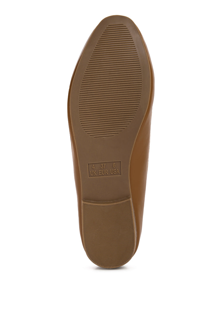 A pair of stylish chunky metal chain faux leather loafers featuring an almond toe and slip-on design, perfect for daily wear.