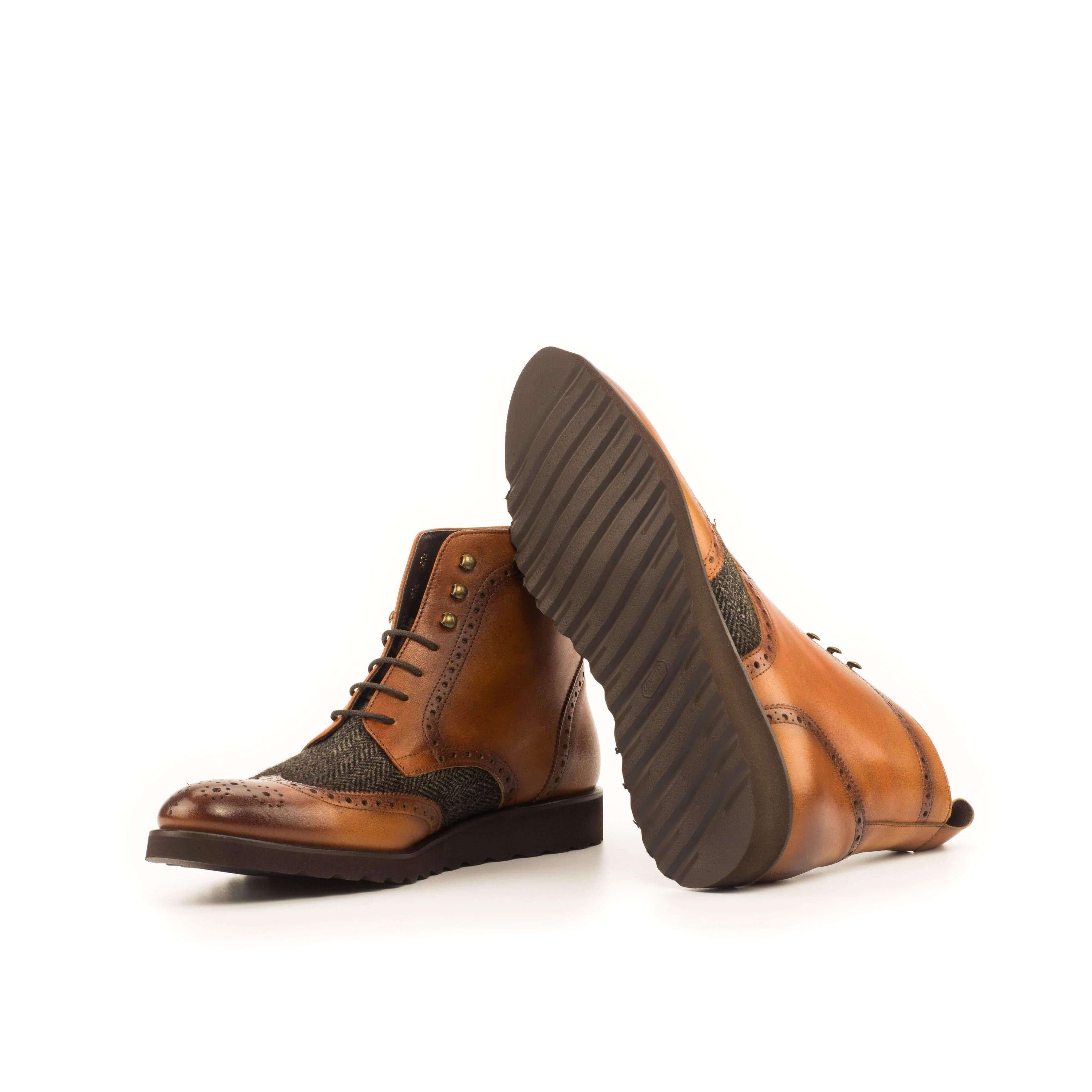 Cina Military Brogue Boots II featuring a brogue pattern and cognac painted calf leather, showcasing a rugged yet refined design.