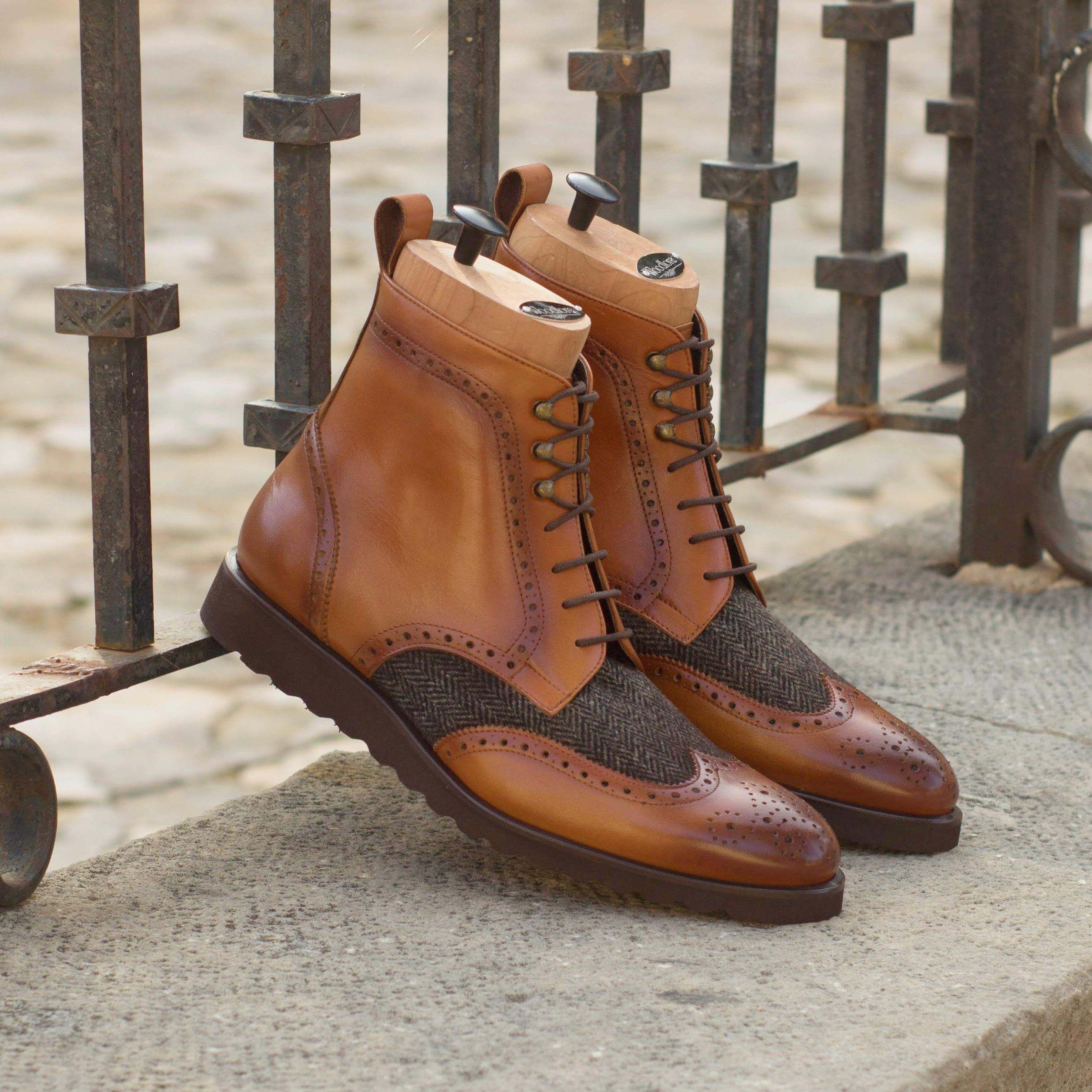 Cina Military Brogue Boots II featuring a brogue pattern and cognac painted calf leather, showcasing a rugged yet refined design.