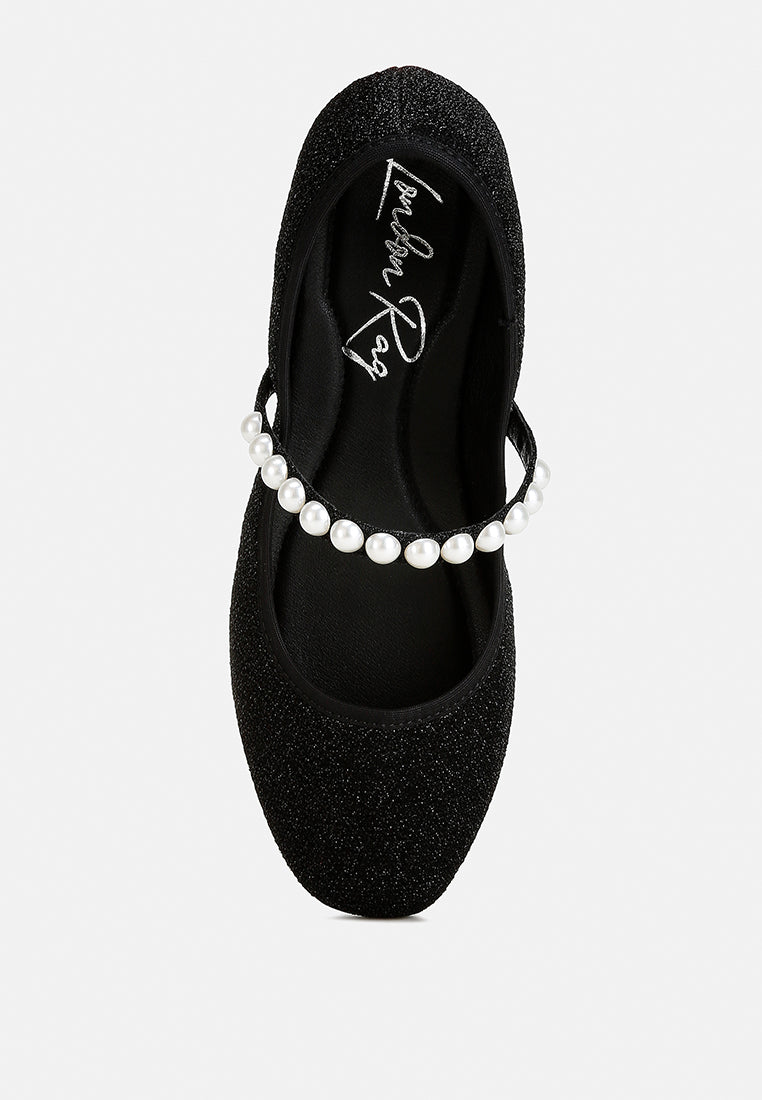 Elegant Corphee Pearl Strapped Glitter Ballerinas featuring a closed round toe, embellished with pearls and a flexible sole.