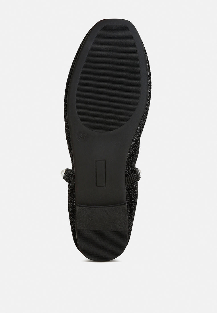 Elegant Corphee Pearl Strapped Glitter Ballerinas featuring a closed round toe, embellished with pearls and a flexible sole.