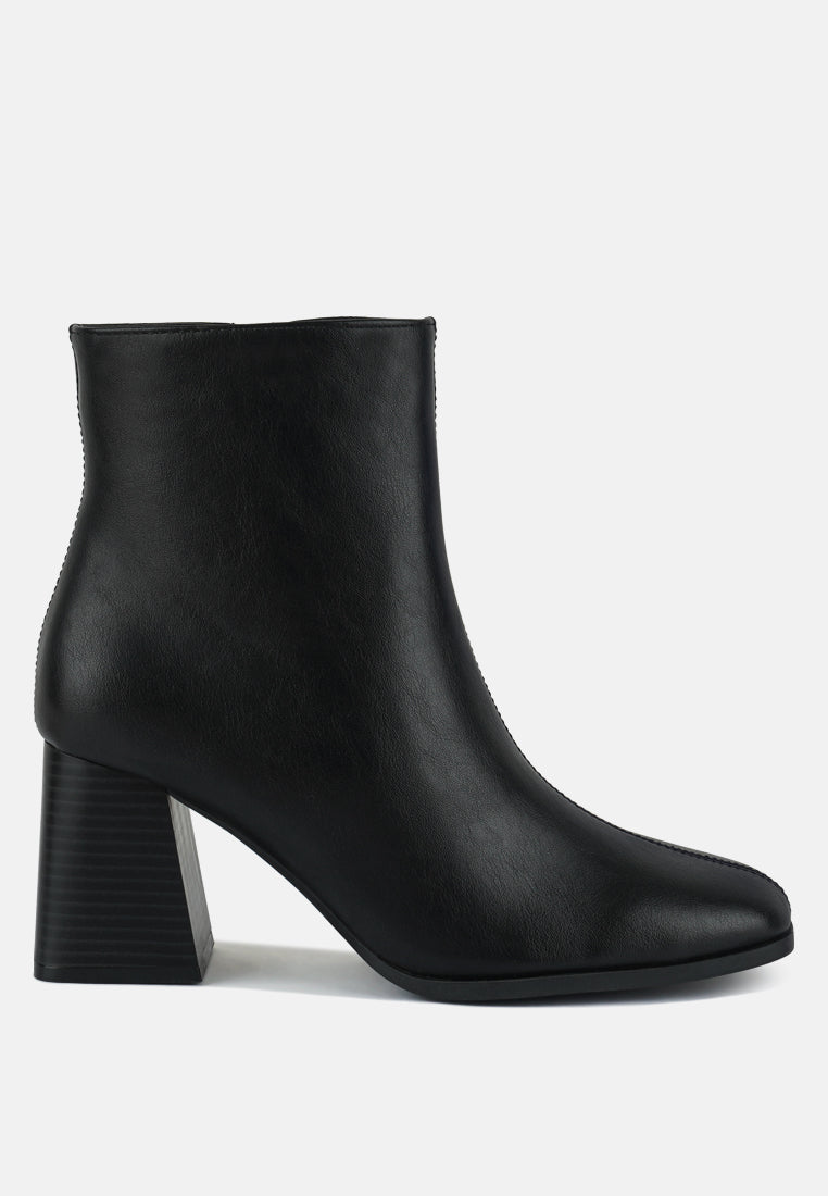 Cox Cut Out Block Heeled Chelsea Boots featuring a stylish cut-out design, wooden block heel, and zip fastening.